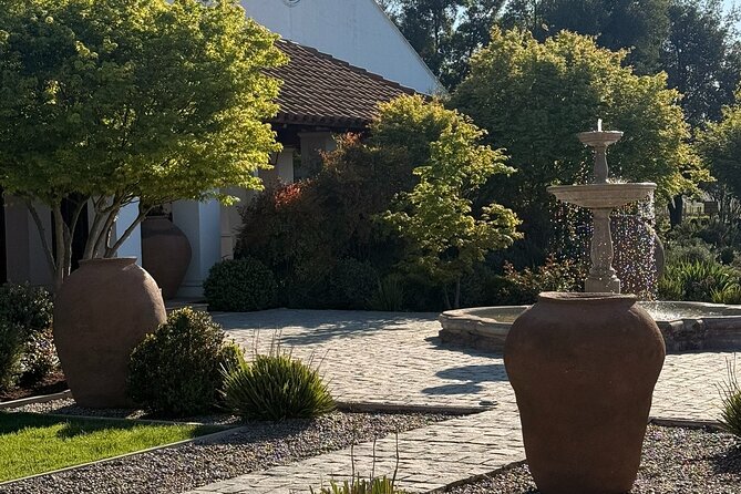 Forest Houses Tour with Tannin Lunch and Selected Tasting - Walking through the gardens, vines, and production areas